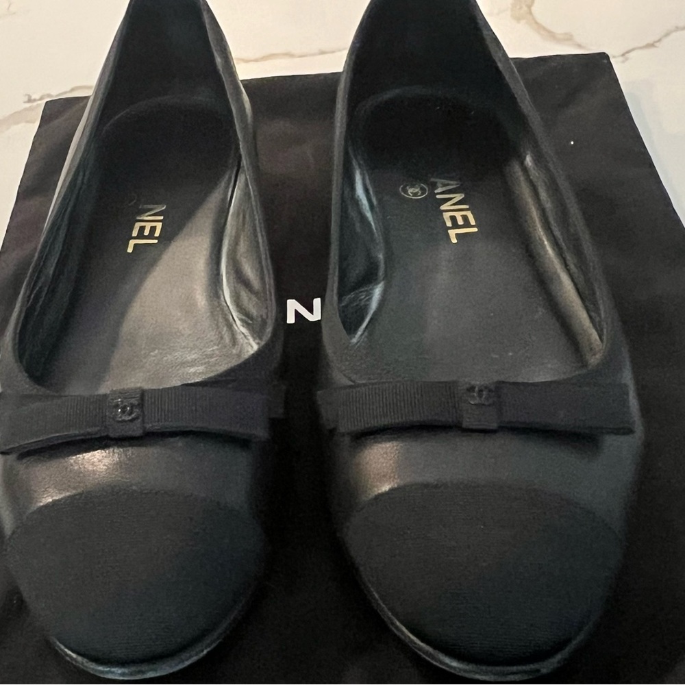 Chanel black flats, leather with grosgrain trip and toe cap, 2 chanel shoe bags
